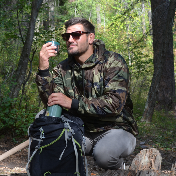 man wearing a woobie hoodie and smiling